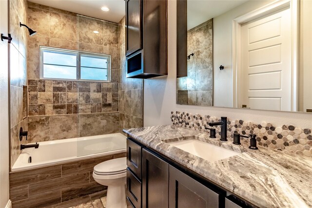 clothes washing area with light tile patterned floors, laundry area, and washing machine and dryer