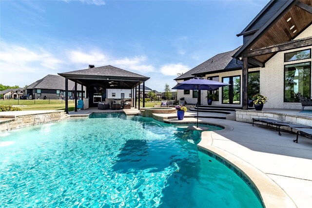view of swimming pool with a patio, an outdoor living space, a ceiling fan, a gazebo, and a pool with connected hot tub