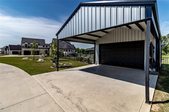 exterior space with a lawn, board and batten siding, fence, and a residential view