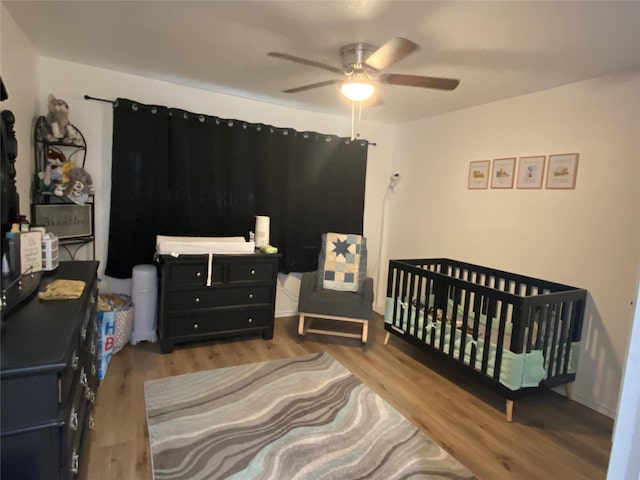 bedroom featuring ceiling fan and wood finished floors