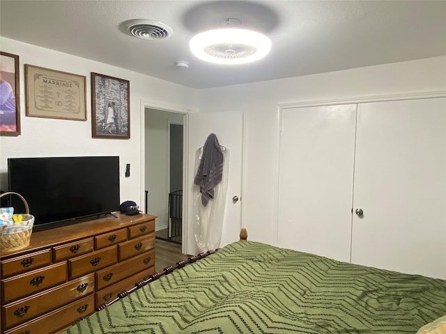 bedroom featuring visible vents