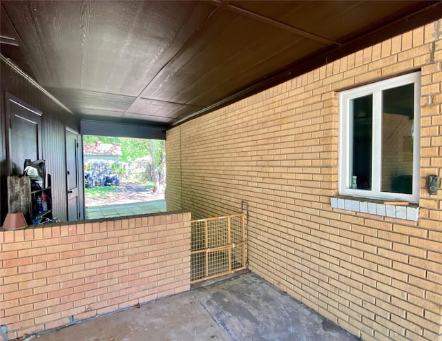 exterior space with brick siding