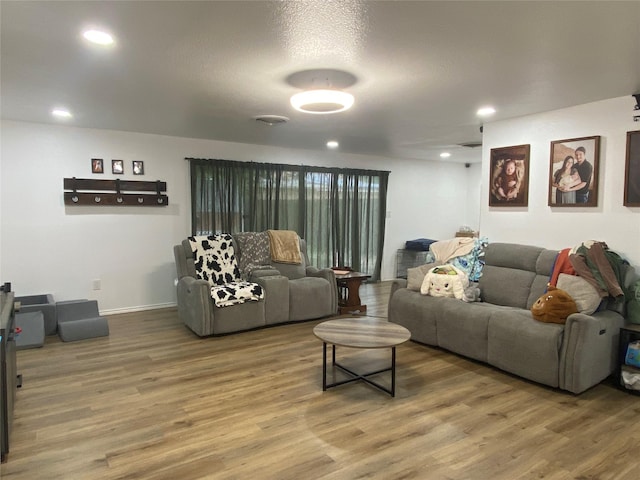 living area featuring recessed lighting and wood finished floors