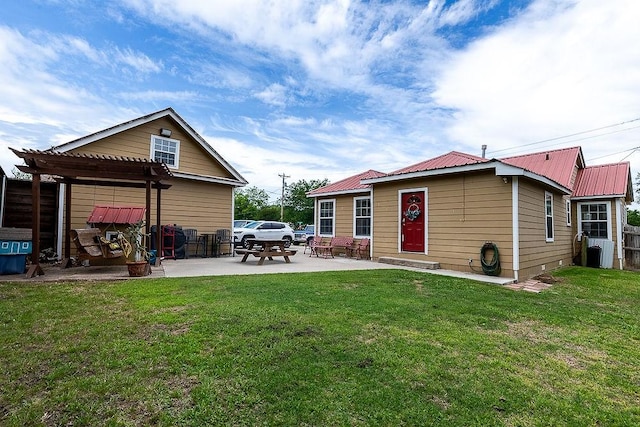 2617 Bourland St, Greenville, TX 75401 - back of house with a pergola, a patio, and metal roof
