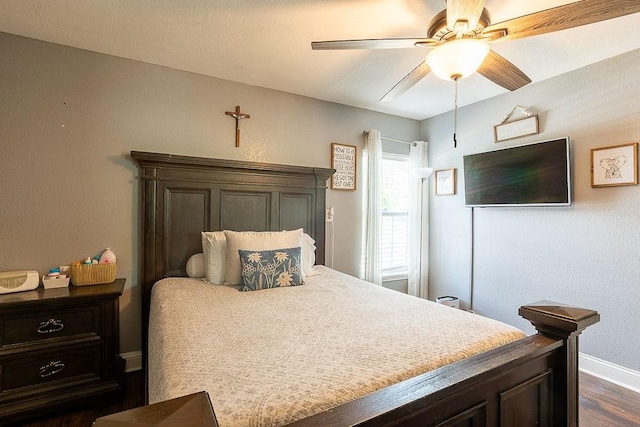 2617 Bourland St, Greenville, TX 75401 - bedroom with baseboards, dark wood-type flooring, and ceiling fan