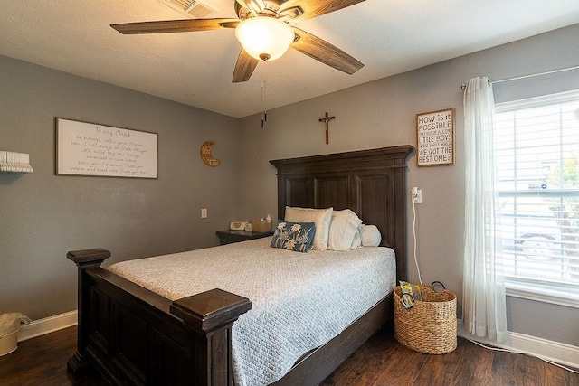 2617 Bourland St, Greenville, TX 75401 - bedroom with baseboards, dark wood-style flooring, and a ceiling fan