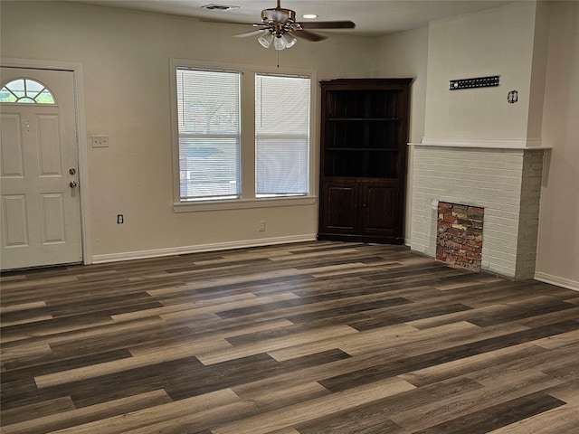 1704 Proctor Ave, Waco, TX 76708 - unfurnished living room featuring a ceiling fan, dark wood-style floors, and baseboards