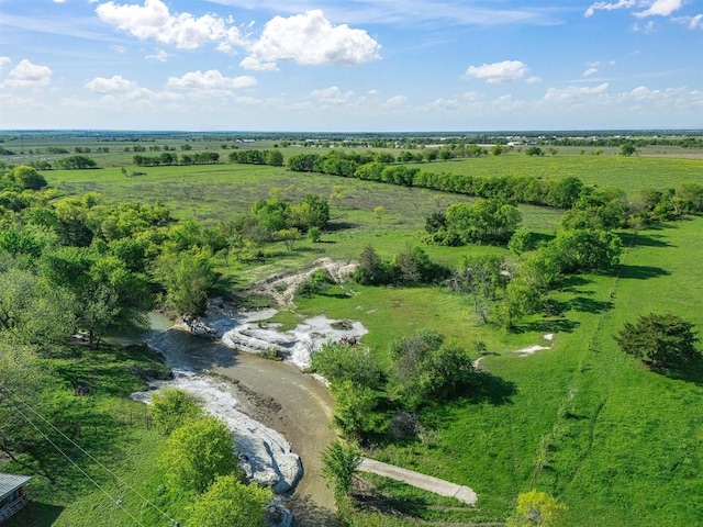 birds eye view of property with a rural view