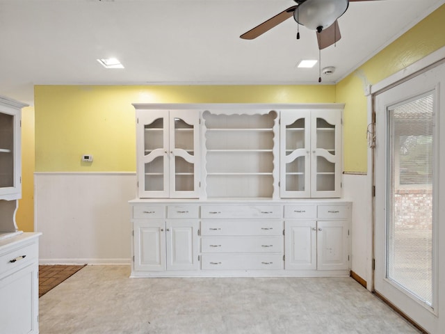 interior space with ceiling fan