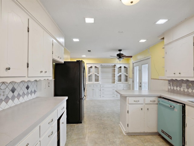 kitchen with ceiling fan, dishwasher, white cabinets, and freestanding refrigerator