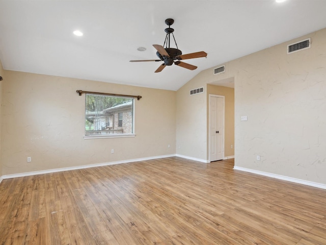 empty room featuring light wood finished floors, visible vents, and ceiling fan