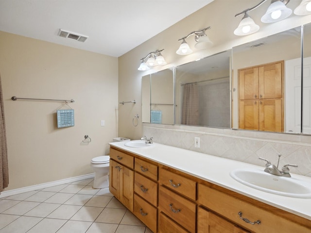 full bathroom featuring baseboards, visible vents, and a sink