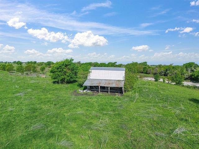 view of yard with a detached carport and an outbuilding