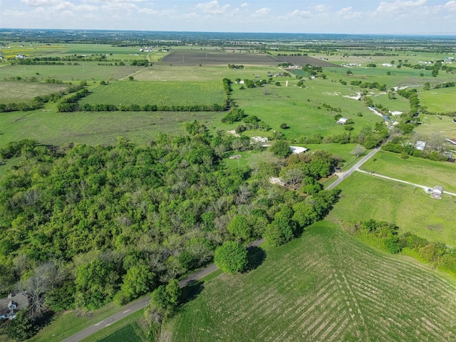 birds eye view of property with a rural view