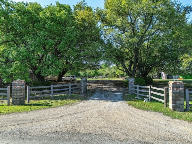view of gate with fence