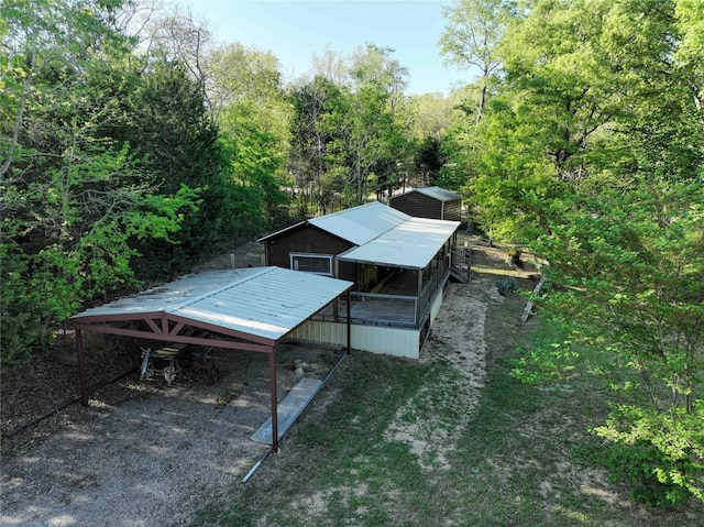 exterior space with a wooded view