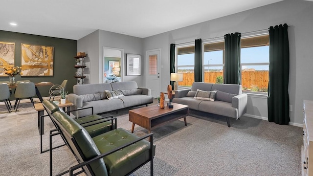 living room featuring baseboards, carpet floors, and recessed lighting