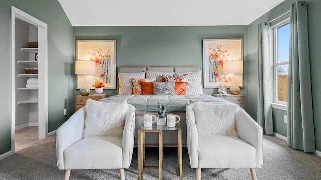 bedroom with baseboards and carpet