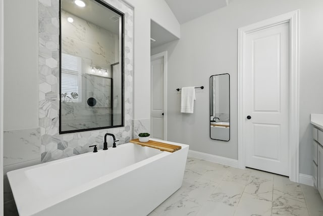 1808 Wren St, Argyle, TX 76226 - full bathroom featuring marble look tile flooring, a marble finish shower, vanity, a soaking tub, and baseboards