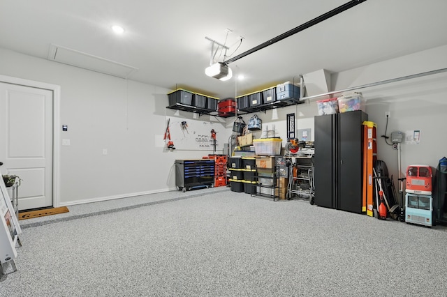 1808 Wren St, Argyle, TX 76226 - garage featuring a garage door opener, baseboards, and a workshop area