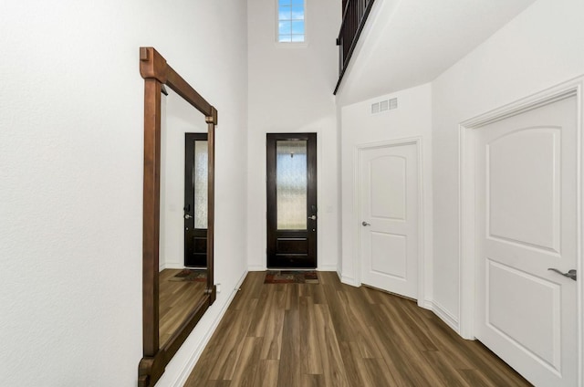 4321 Minnow Cove Rd, Oak Point, TX 75068 - entrance foyer with a towering ceiling, visible vents, dark wood-style floors, and baseboards