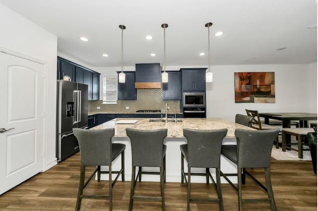 4321 Minnow Cove Rd, Oak Point, TX 75068 - kitchen featuring premium range hood, a breakfast bar, light stone countertops, and stainless steel appliances