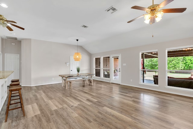 8405 Evening Star Dr, Rowlett, TX 75089 - unfurnished living room with ceiling fan, vaulted ceiling, light wood finished floors, and baseboards