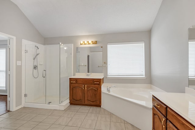 8405 Evening Star Dr, Rowlett, TX 75089 - full bath featuring a stall shower, lofted ceiling, vanity, tile patterned floors, and a bath