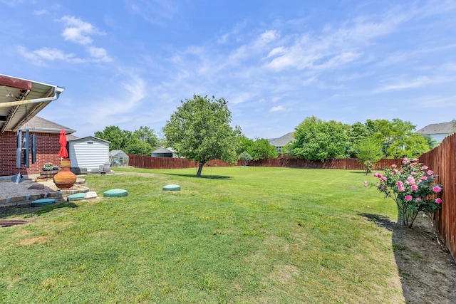 8405 Evening Star Dr, Rowlett, TX 75089 - view of yard featuring a storage unit and an outbuilding
