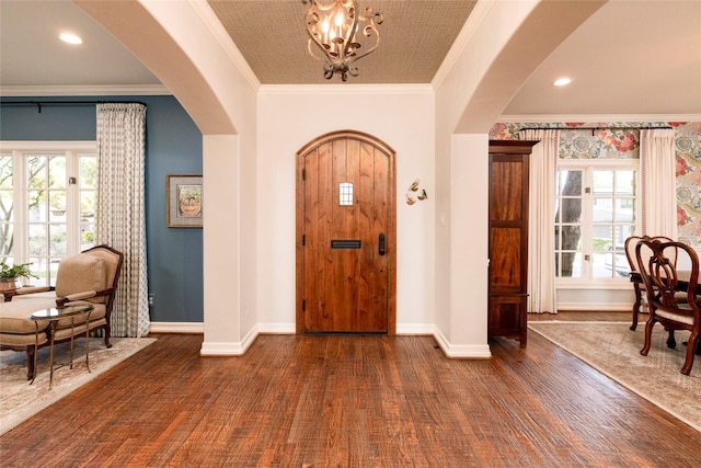 4113 Modlin Ave, Fort Worth, TX 76107 - entrance foyer with arched walkways, an inviting chandelier, plenty of natural light, and dark wood-type flooring