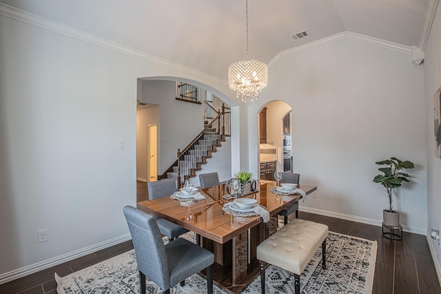 dining room with visible vents, arched walkways, stairway, and dark wood-style flooring