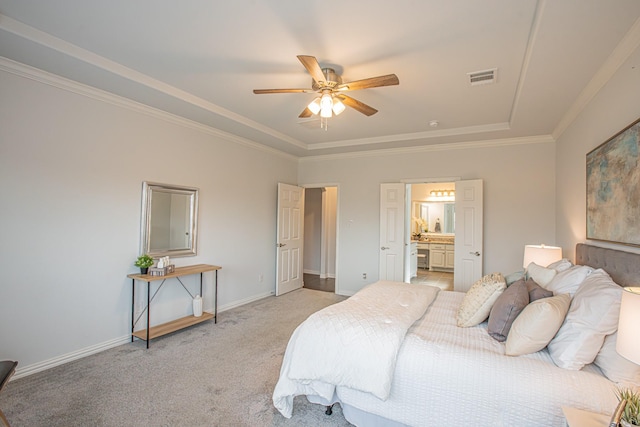 bedroom featuring crown molding, light carpet, a tray ceiling, baseboards, and visible vents