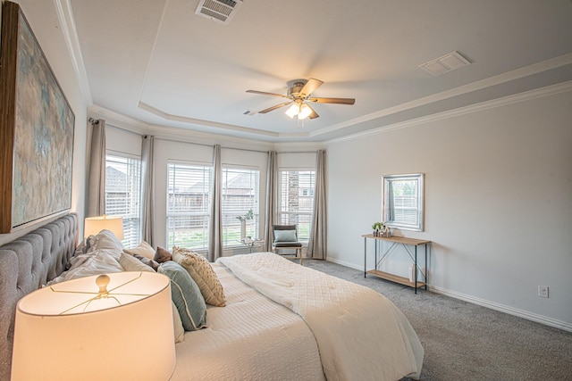 bedroom featuring baseboards, visible vents, carpet floors, and a tray ceiling