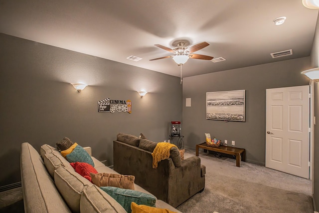 cinema with visible vents, carpet floors, and ceiling fan