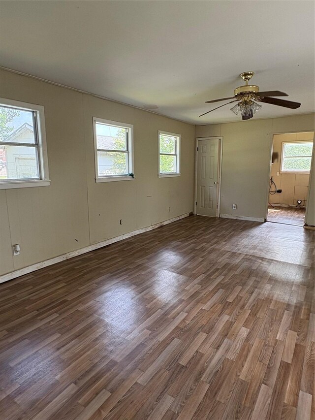 215 Fair Park St, Riesel, TX 76682 - empty room with healthy amount of natural light and wood finished floors