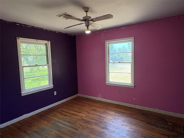 215 Fair Park St, Riesel, TX 76682 - empty room featuring wood finished floors, plenty of natural light, a ceiling fan, and baseboards