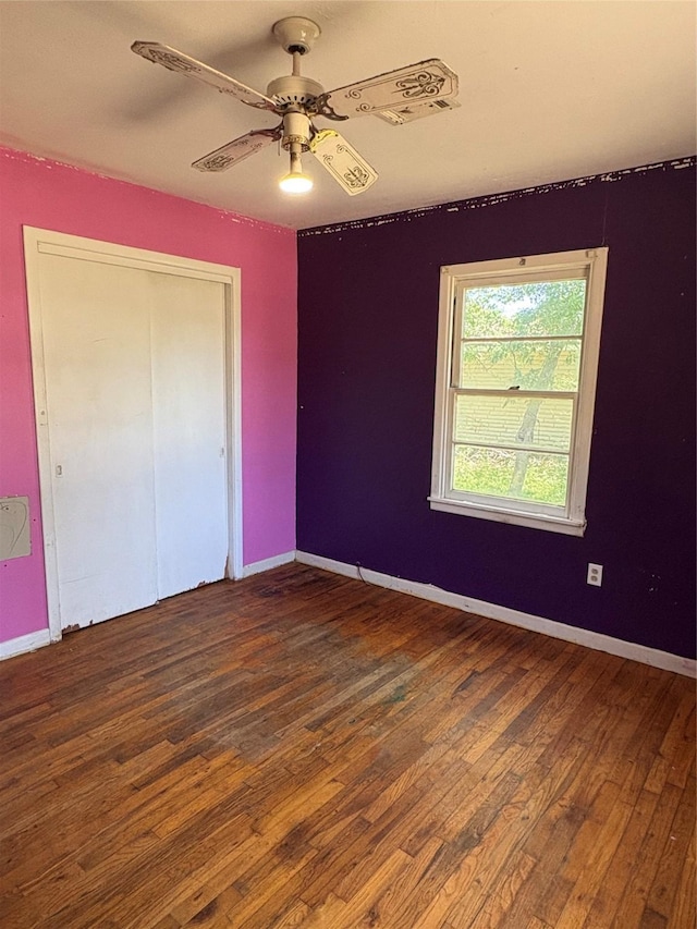 215 Fair Park St, Riesel, TX 76682 - unfurnished bedroom featuring hardwood / wood-style flooring, a ceiling fan, baseboards, and a closet