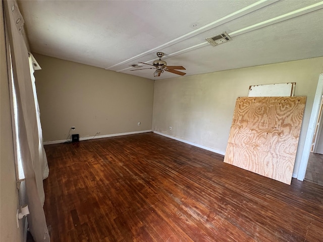 215 Fair Park St, Riesel, TX 76682 - spare room featuring hardwood / wood-style flooring, a ceiling fan, and baseboards
