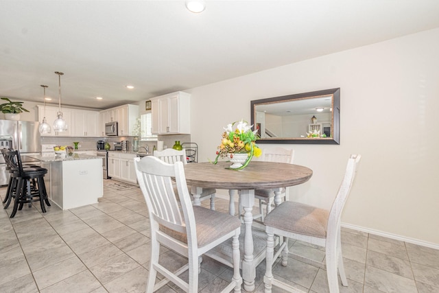 dining space featuring recessed lighting