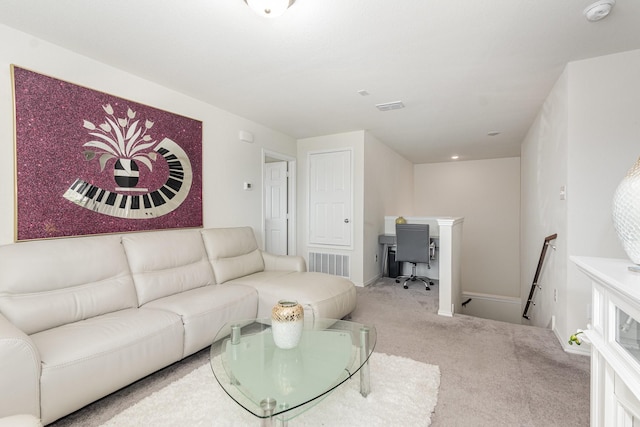 carpeted living area with visible vents