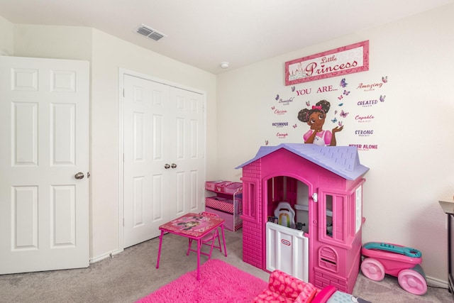 rec room featuring visible vents and carpet