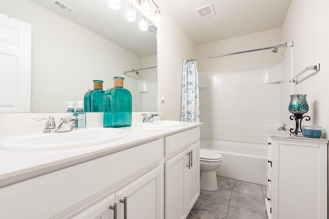full bathroom featuring double vanity, visible vents, and a sink