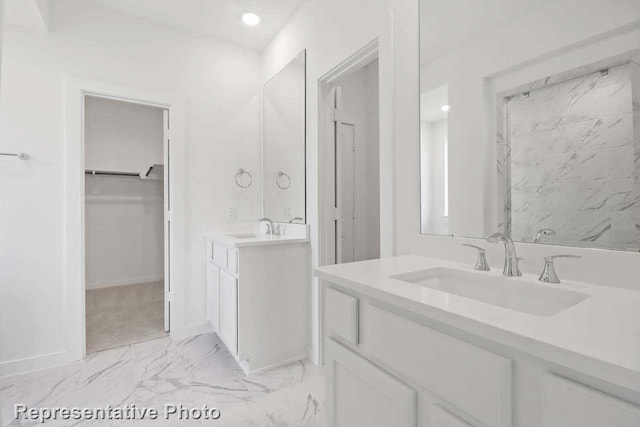 3705 Hickory St, Sherman, TX 75092 - full bath with two vanities, marble finish floor, a sink, and a walk in closet