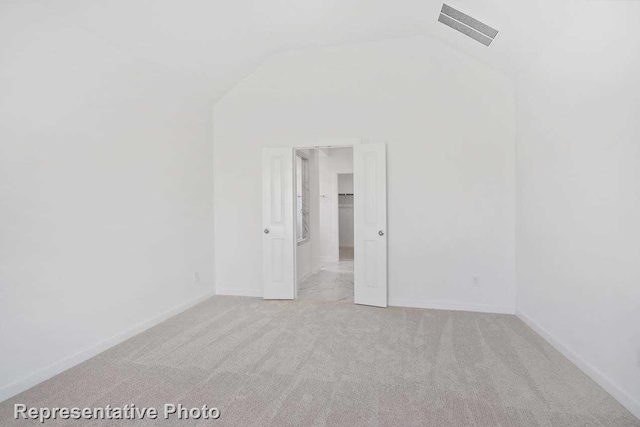 3705 Hickory St, Sherman, TX 75092 - spare room with lofted ceiling, visible vents, carpet flooring, and baseboards