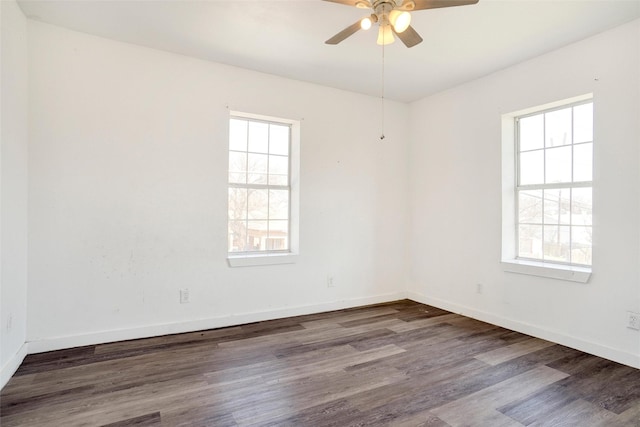 unfurnished room featuring baseboards, a ceiling fan, and wood finished floors