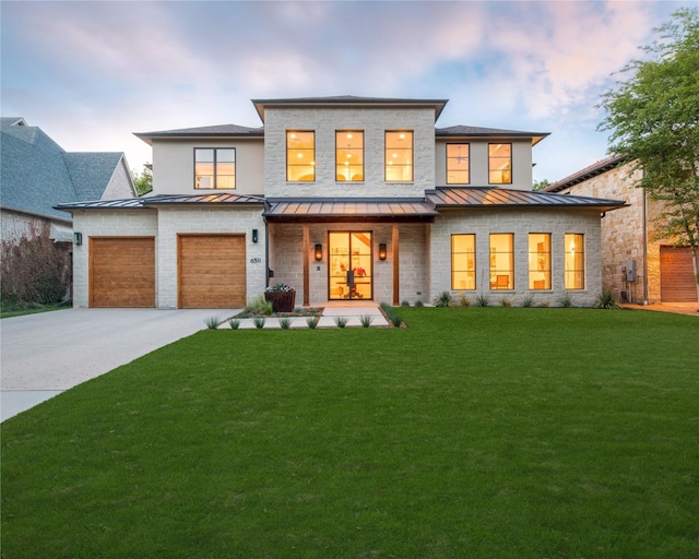6511 Mimosa Ln, Dallas, TX 75230 - view of front facade featuring a standing seam roof, driveway, a yard, a porch, and a garage
