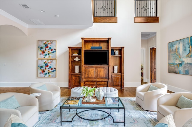 6511 Mimosa Ln, Dallas, TX 75230 - living area with crown molding, wood finished floors, and baseboards