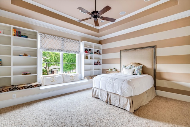 6511 Mimosa Ln, Dallas, TX 75230 - carpeted bedroom featuring a tray ceiling, ornamental molding, and ceiling fan