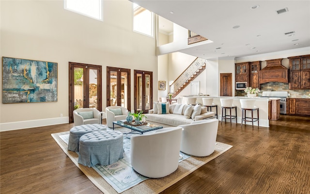6511 Mimosa Ln, Dallas, TX 75230 - living room featuring stairs, dark wood-type flooring, baseboards, and a high ceiling