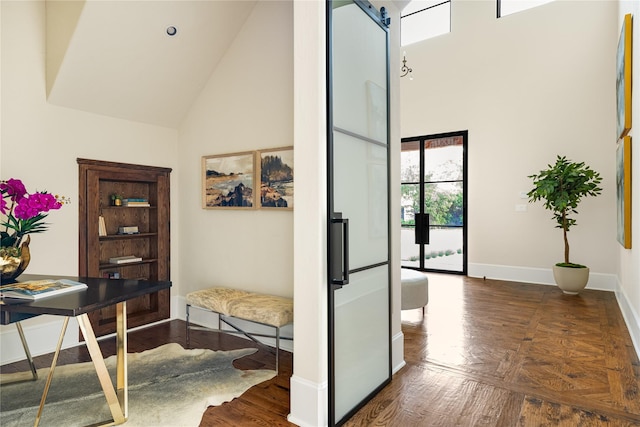 6511 Mimosa Ln, Dallas, TX 75230 - hall featuring high vaulted ceiling, healthy amount of natural light, baseboards, a barn door, and wood finished floors